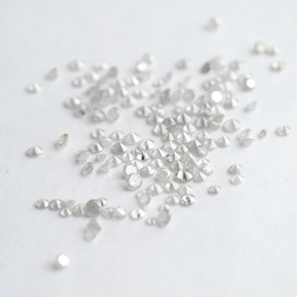 Natural misty white round brilliant cut melee diamond lot weighing 4.62 carats with loose diamonds measuring 1.3 mm to 2.5 mm, ideal for engagement rings, wedding bands, earrings, pendants, bracelets and custom fine jewelry